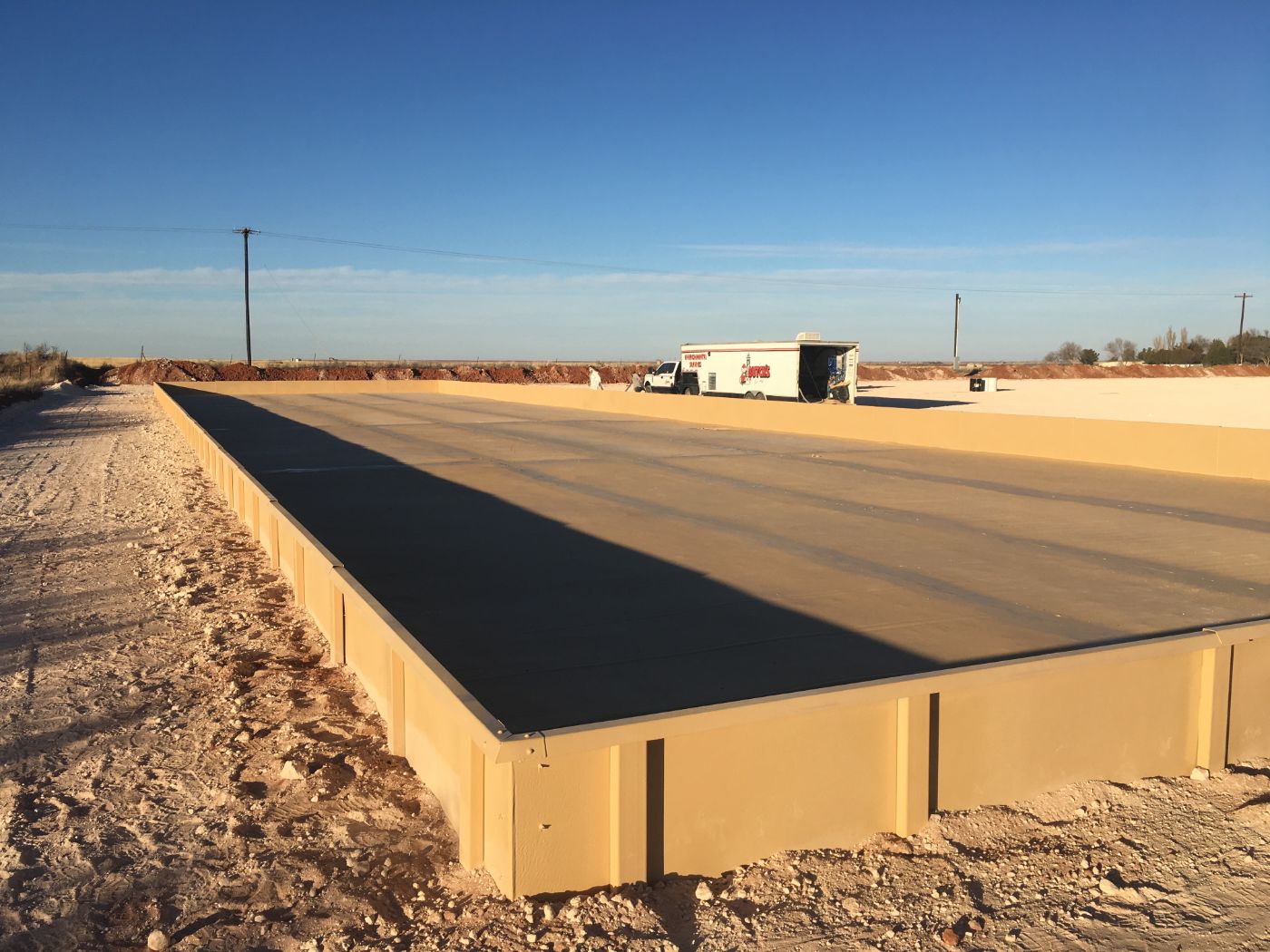 Polyurea sprayed geotextile
