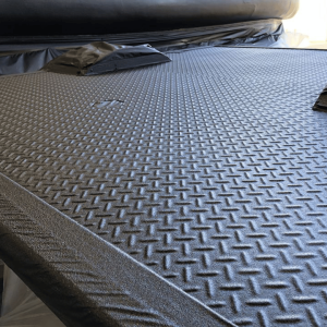 Polyurea for enclosed utility bodies and workshop vehicles