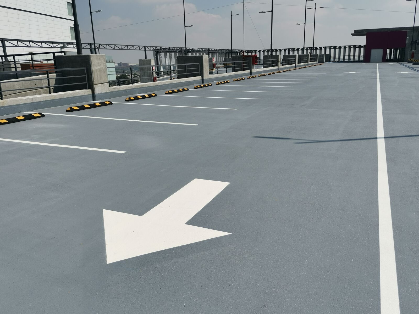 Contractor-applied polyurea traffic deck coating